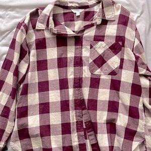 Shirt is maroon with white